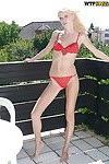 Slippy blonde amateur with long legs gets rid of her lingerie outdoor