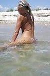 Amateur babe with perfect ass and slender legs poses on the beach