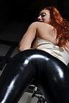 Kinky redhead teasing in black latex leggings