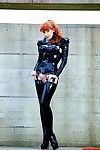Redhead mistress in latex