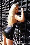 Blonde saschas rubber boots and latex outfit posed outdoors by s