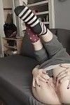 Pornstar Yhivi stretches pussy lips of hairy cunt wide open in socks