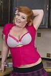 Naughty chubby housewife getting frisky in the kitchen