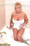Busty mature sucking in a tub