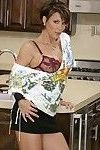Big titted MILF strips in the kitchen and feels her craving pussy