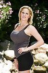 Curvaceous blonde MILF on high heels Zoey Holiday stripping by the pool