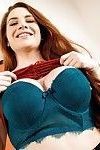 Girl with red hair Veronica Vain revealing large boobs and trimmed muff
