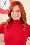 Sweet redhead strips in her office