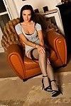 Sophia in stockings posing on sofa