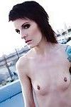Skinny alt babe with tattooed body exposing tiny tits outdoors on rooftop