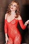 Glamorous pornstar in red lace bodystockings getting off with a dildo