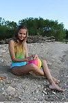 Sweet brunette filly Mango A reveals her shaved pussy at the beach