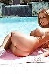 Ravishing babe Nikki Delano gets rid of her sport outfit at the poolside