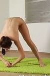 Brunette teen gymnast strips to nothing for erotic yoga