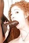 Redhead svelte MILF with hairy twat gobbles and fucks a huge black tool