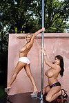 Busty European babes showing striptease on the pole outdoor