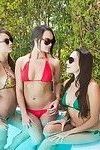 Stunning young hotties have threesome lesbian humping pool fun