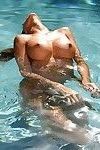 Appealing Latina milf Kayla Carrera teases herself in the pool