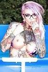 Tattooed bikini clad Sydnee Vicious in glasses spreading ass by the pool