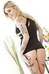 Inked blonde babe Kleio Valentien freeing big tits and ass from dress