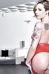 Tattooed babe Dahlia Sky strutting solo in assless latex miniskirt