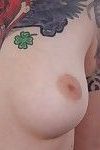 Tattooed girl poses nude