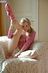Frisky teenie in pink socks taking off her panties and fingering her slit