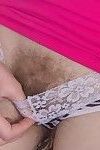 Dani strips off pink shirt to get naked