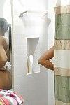 Ebony Adrian Maya undressing and taking shower in voyeur scene
