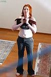 Hidden camera captures all natural redhead pulling panties over nice ass