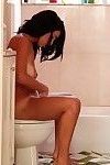 Tempting latina girl gets caught on voyeur video pissing and taking shower