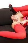 Lecherous chick in red stockings stretching her pink hole with her fingers