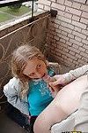Curly-haired teenage slut gives a sloppy blowjob outdoor