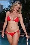 Aged blonde Jodi West loosing nice tits from bikini in swimming pool