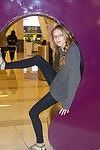 Skinny playful blonde teen Reese Berkman bending over in a store