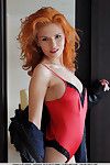 Stocking and lingerie attired redhead babe Zarina A exposing big teen boobs