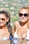 Bikini clad babes wearing glasses flashing nice tits and hot ass in the pool