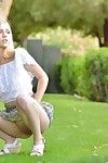 Horny blonde teen gives naked upskirt showing bald pussy outdoors