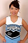 Amateur Asian solo girl sheds cheerleader uniform to bare tiny teen tits