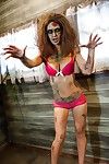 Saucy brunette cosplayer Kleio unveils her zombie tits and pussy