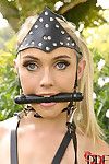 Blonde babe Chloe Toy is restrained outdoors with pony bit gag in mouth