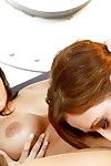 Redhead Capri Cavalli is sucking hard nipples of Sunny Leone