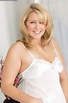 Chunky mature blonde Amarillo slips off satin lingerie and plays with her twat