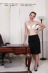 Mature woman Heidi Van Moore modeling naked in her office after disrobing