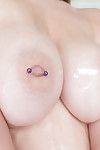 Leggy blonde teen Kimber Lee showing off pierced nipples and puffy twat